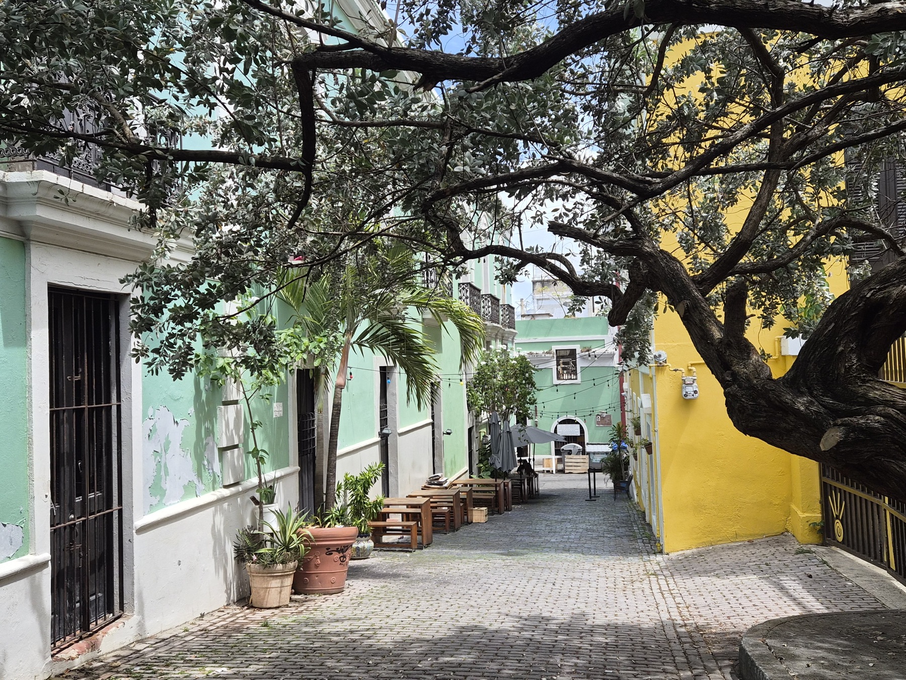 Shaded alley with colorful facades in Old San Juan on the way to La Perla