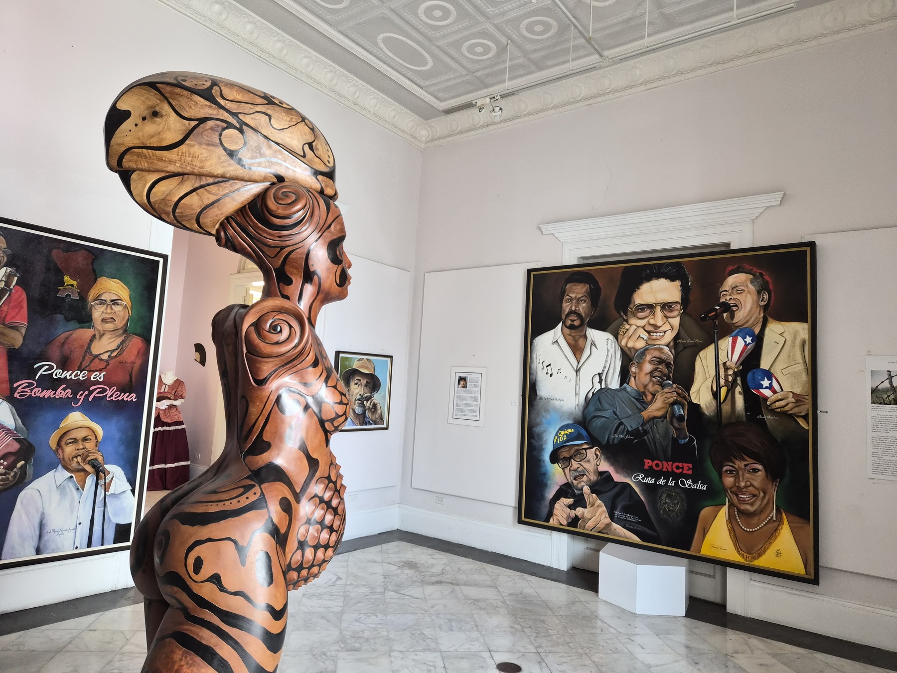 Taino inspired sculpture and portraits of Ponce musicians on display