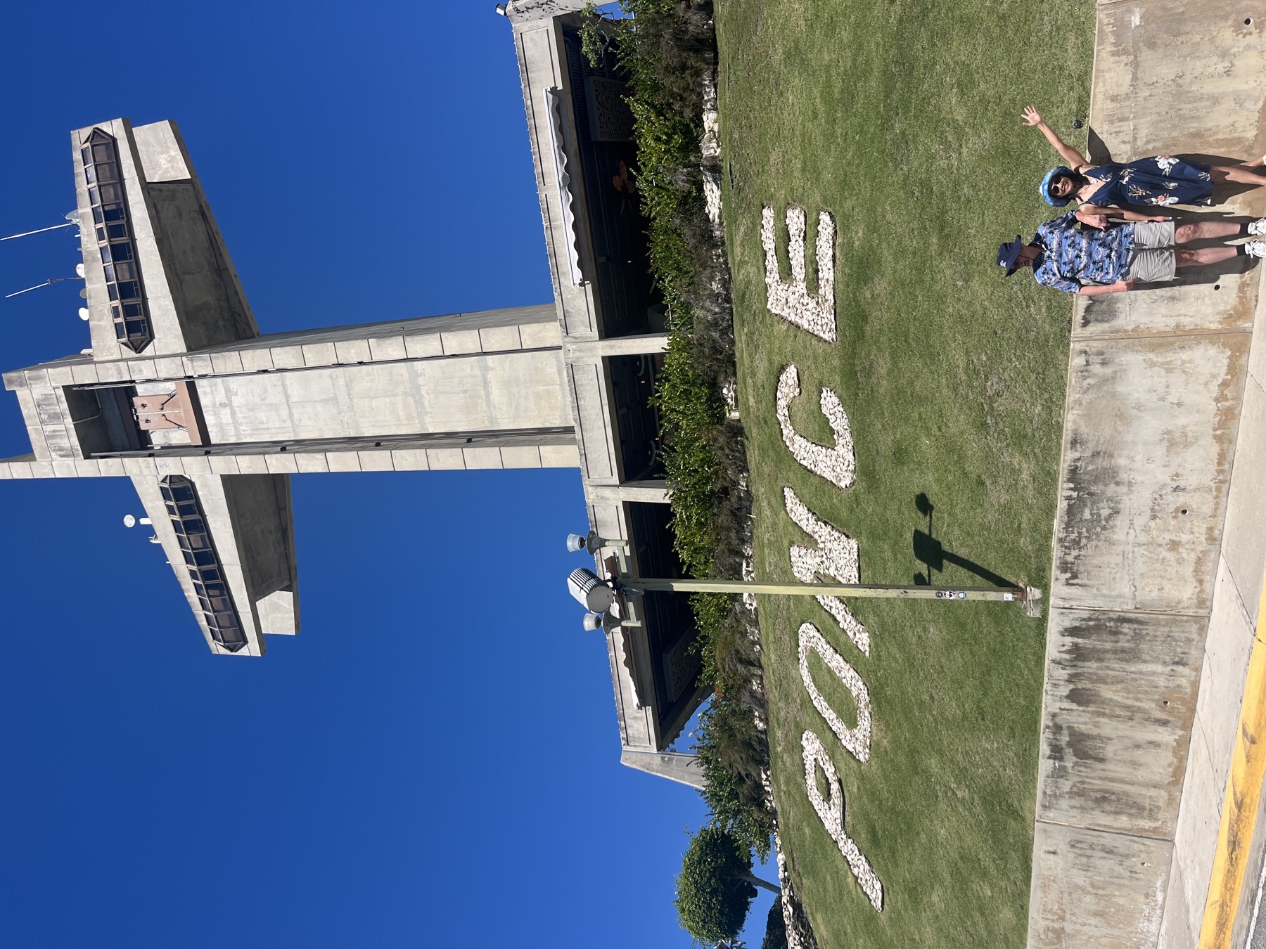 Ponce spelled out in white stones below the Cruceta del Vigia