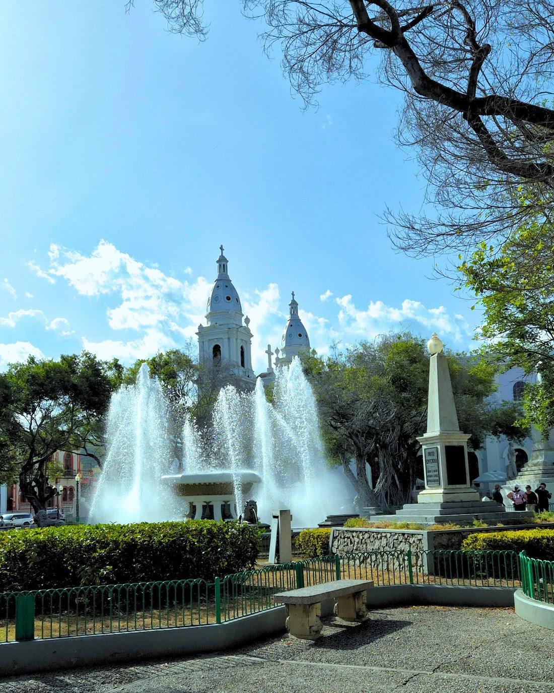 Fountain and cathedral towers on the main plaza of Ponce