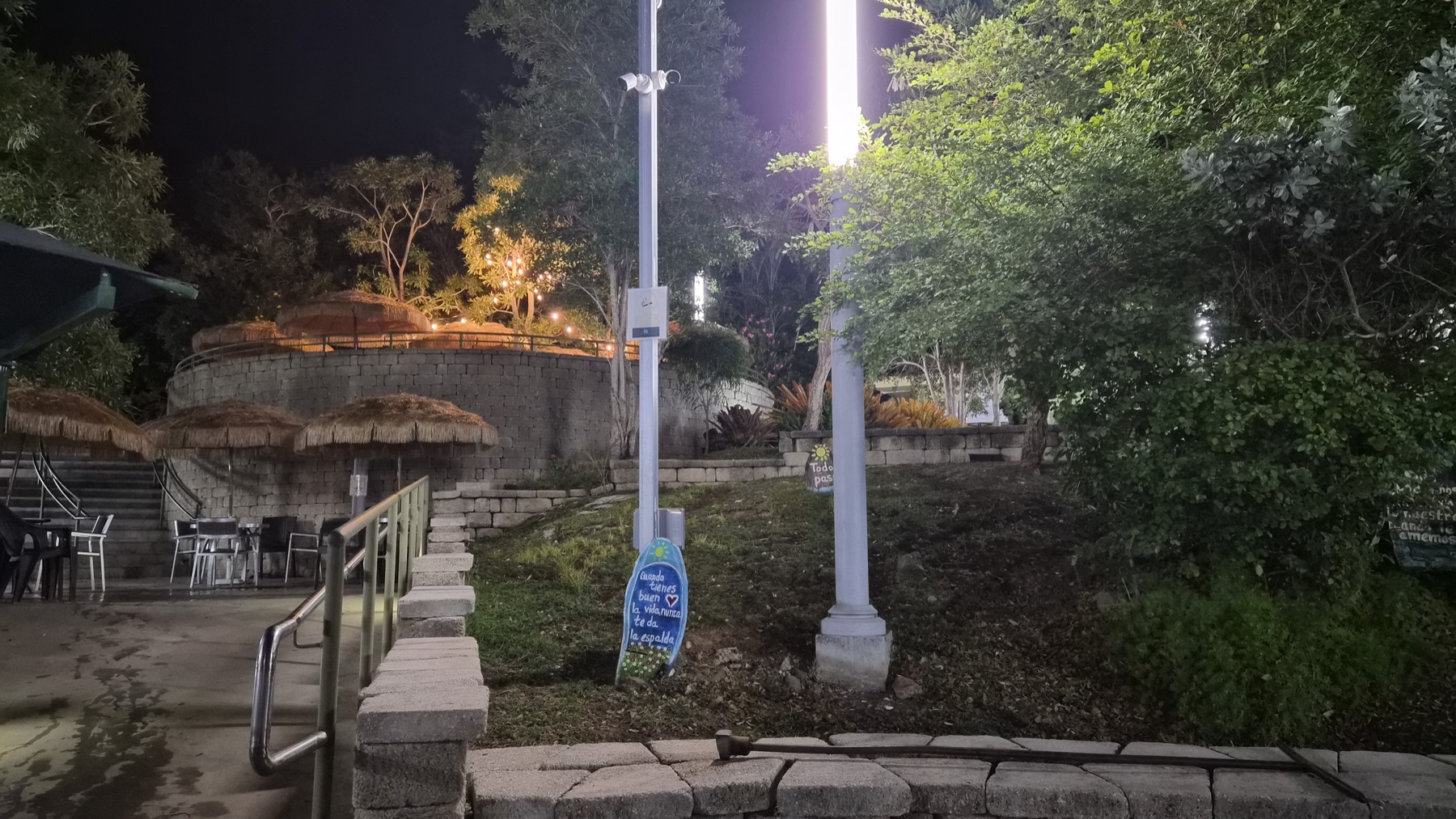 Lantern-lit walkways at the Coamo thermal baths after dark